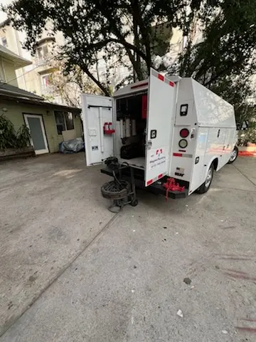 Magnet Plumbing service vehicle on-site for Grease Trap Cleaning in Poplar-Davie